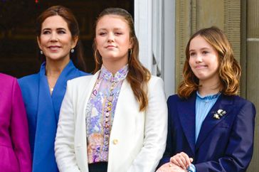 Queen Margrethe II of Denmark with Crown Princess Mary, Prince Christian and Princess Isabella during Changing of the Guards on the occasion of the 18th birthday celebrations of the Prince at Frederik VIII, Brockdorff's Palace at Amalienborg in Copenhagen, Denmark.