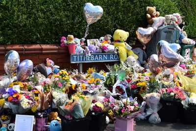 Floral tributes are left for the victims of a deadly knife attack in Southport, northwest England, on July 31, 2024. Violent clashes broke out in the northern England town where a mass stabbing at a Taylor Swift-themed dance event claimed the lives of three children.