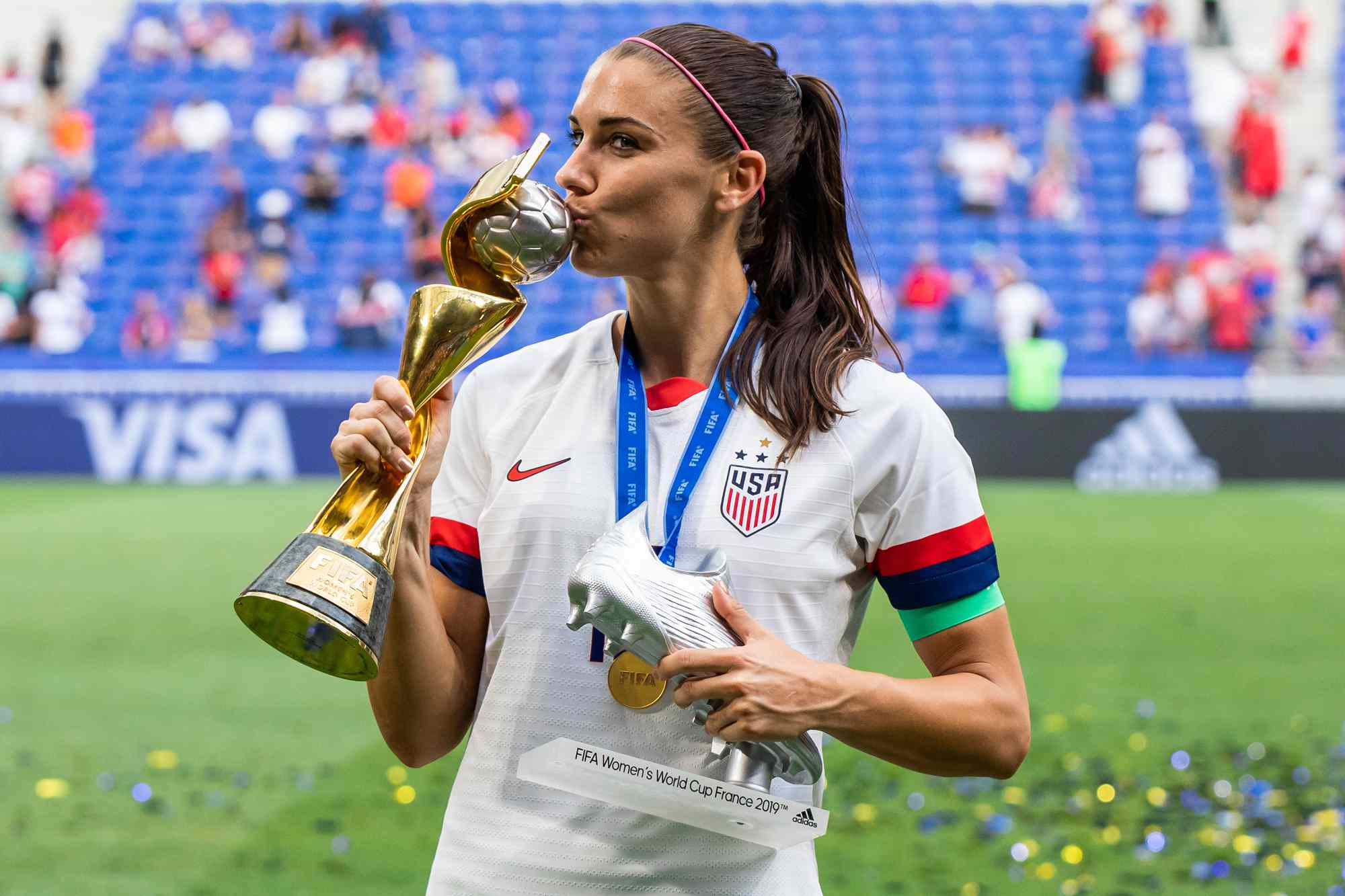 Alex Morgan of the USA women's national team celebrating with trophy and the second best scorer in the tournament award after the 2019 FIFA Women's World Cup Final match between The United States of America and The Netherlands at Stade de Lyon.