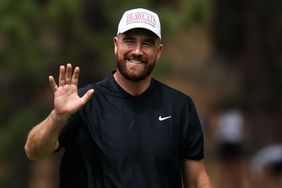 NFL football player Travis Kelce waves to fans at the 18th hole on day three of the 2024 American Century Championship at Edgewood Tahoe Golf Course