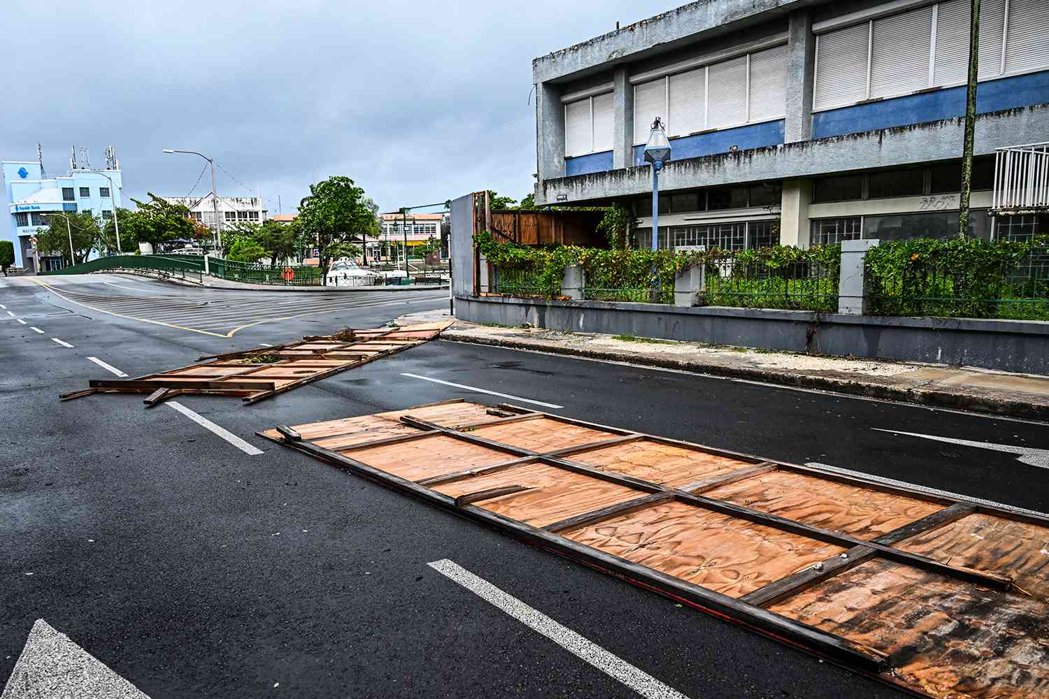 Billboards are seen fallen on the street as hurricane Beryl passes near to Bridgetown, Barbados on July 1, 2024. 