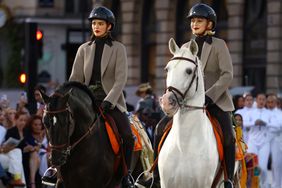 Kendall Jenner and Gigi Hadid ride horses on the runway during Vogue World: Paris at Place Vendome on June 23, 2024 in Paris, France.