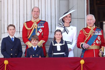 Prince George of Wales, Prince William, Prince of Wales, Prince Louis of Wales, Catherine, Princess of Wales, Princess Charlotte of Wales and King Charles III on the balcony during Trooping the Colour at Buckingham Palace on June 15, 2024 in London, England. Trooping the Colour is a ceremonial parade celebrating the official birthday of the British Monarch. The event features over 1,400 soldiers and officers, accompanied by 200 horses. More than 400 musicians from ten different bands and Corps of Drums march and perform in perfect harmony.