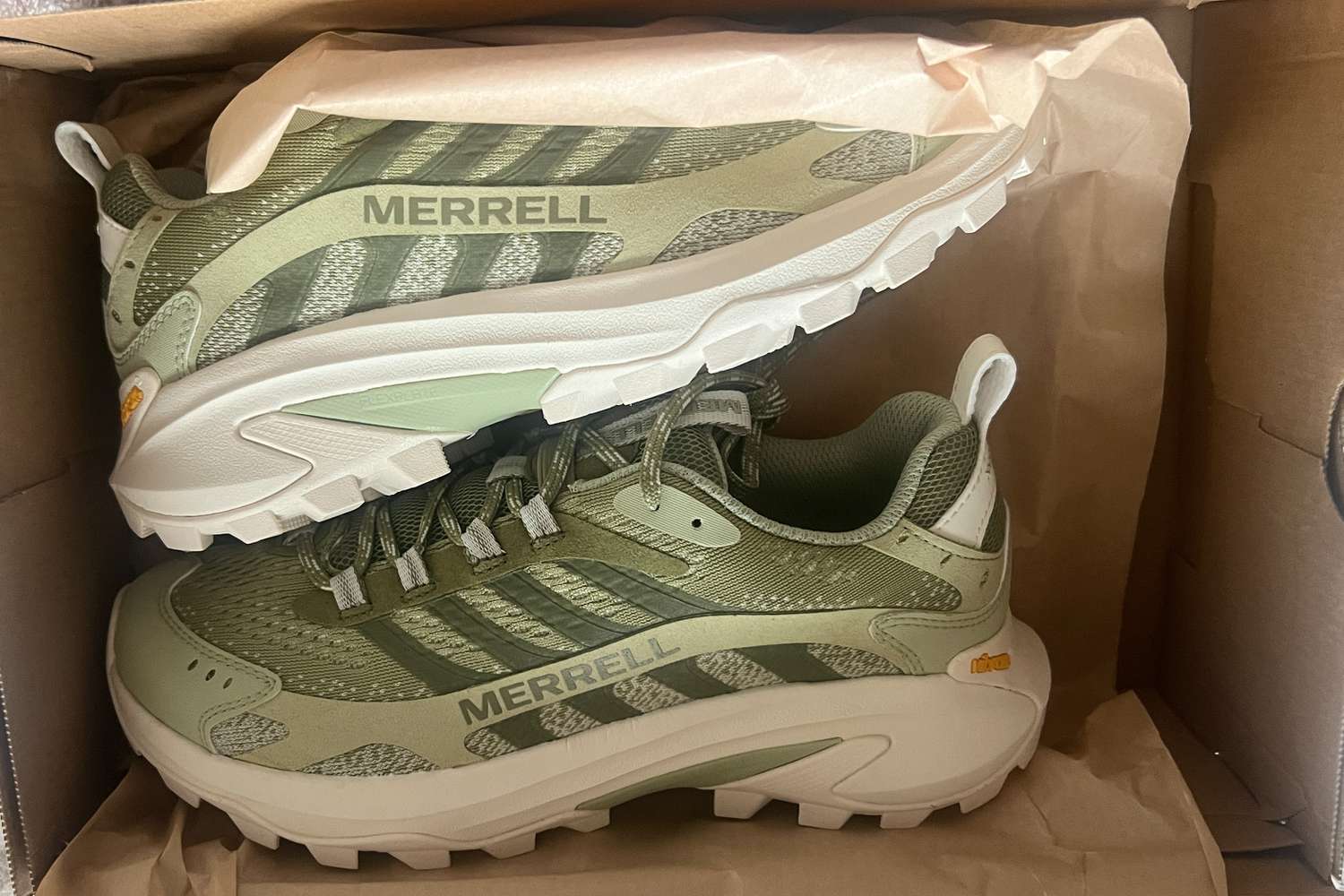 A pair of Merrell Women's Moab Speed 2 Hiking Shoes in the box before use