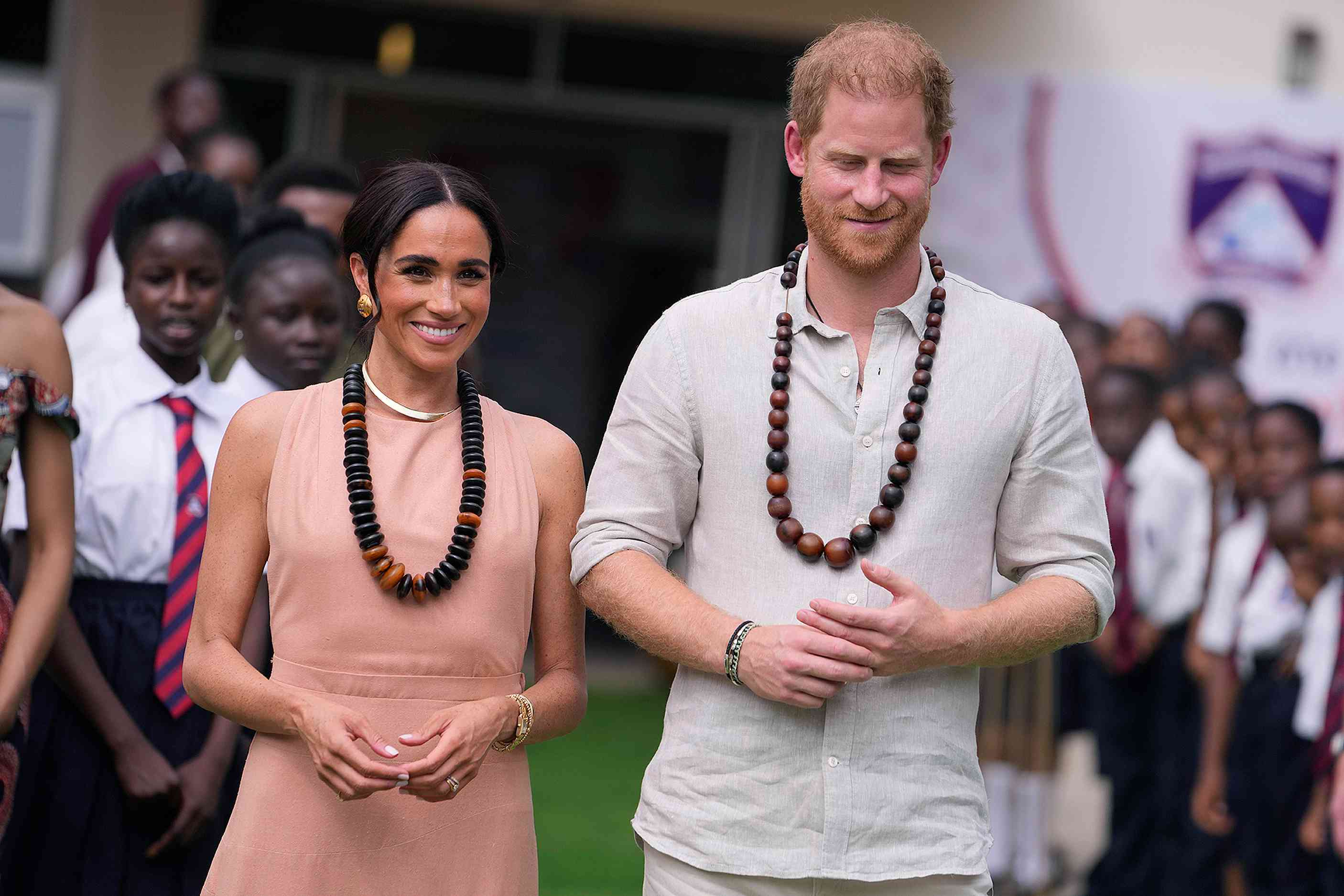 Prince Harry and Meghan visit children at the Lights Academy in Abuja, Nigeria, Friday, May 10, 2024. Prince Harry and his wife Meghan have arrived in Nigeria to champion the Invictus Games, which he founded to aid the rehabilitation of wounded and sick servicemembers and veterans.