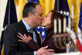 Vice President Kamala Harris and second gentleman Doug Emhoff kiss during an event in the East Room of the White House in Washington, to light the menorah to celebrate Hanukkah, Wednesday, Dec. 1, 2021. 