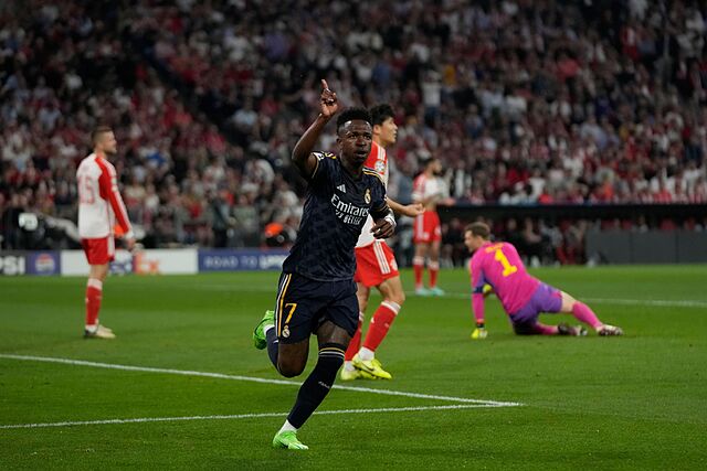 Vinicius Junior celebrates after scoring the opening goal of the match