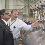 Chairman of the Indian Atomic Energy Commission and Secretary to the Government of India, Department of Atomic Energy Sekhar Basu discusses cryogenics with Fermilab engineer Rich Stanek