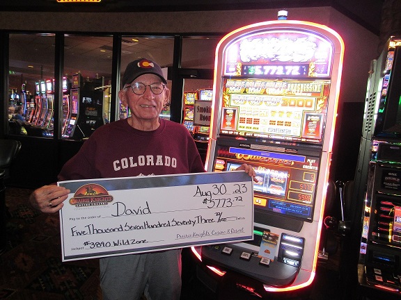 Person holding large check