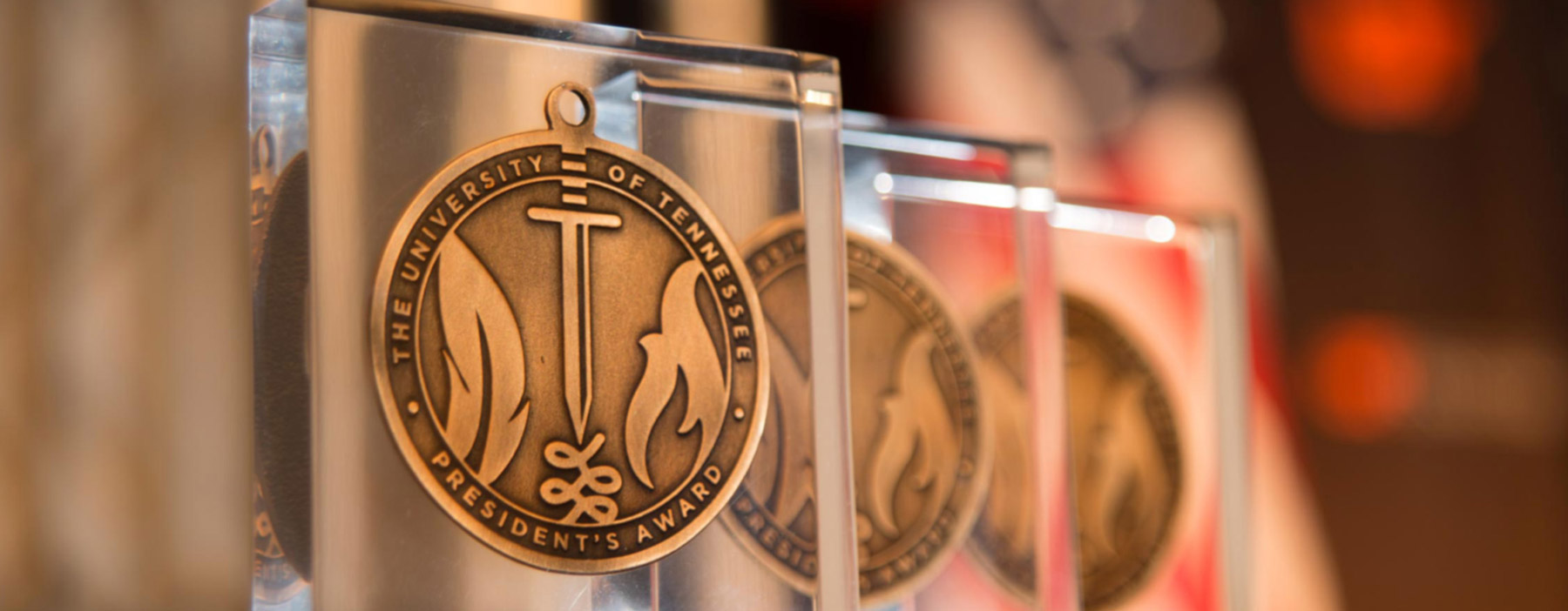 close up of three president awards trophies