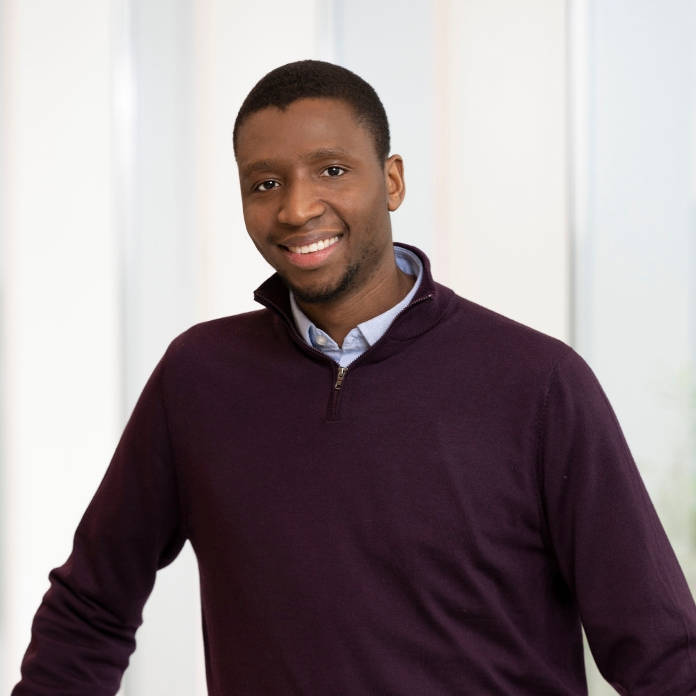 Headshot of a young man standing in front of a white background