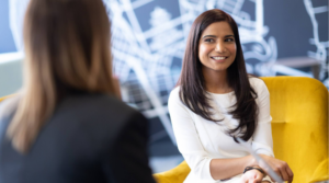 Smiling woman is collaborating with her colleague