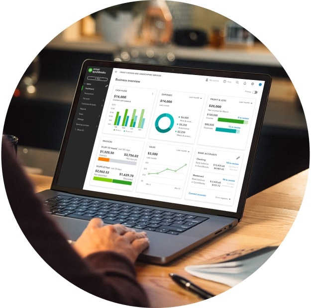 A laptop in a small business displaying the QuickBooks dashboard