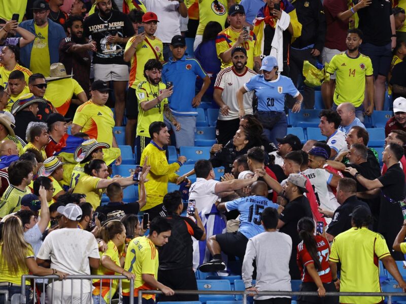 CHARLOTTE, NORTH CAROLINA - JULY 10: Fans of Colombia fight with fans and players of Uruguay after the CONMEBOL Copa America 2024 semifinal match between Uruguay and Colombia at Bank of America Stadium on July 10, 2024 in Charlotte, North Carolina. (Photo by Tim Nwachukwu/Getty Images)