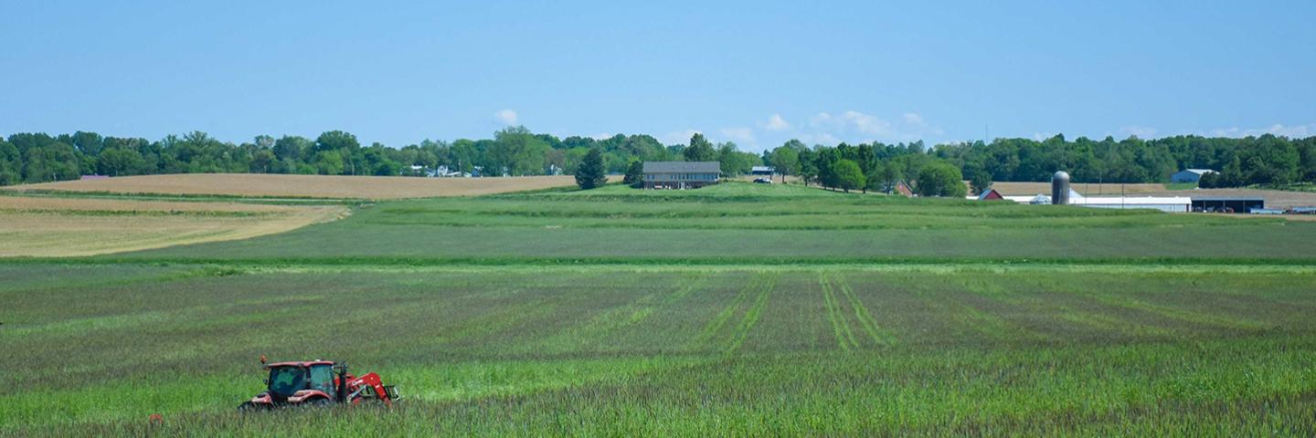 An agricultural scene with a combine.