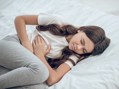 teen girl with stomach ache