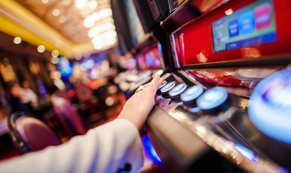 Person playing video slot in the casino