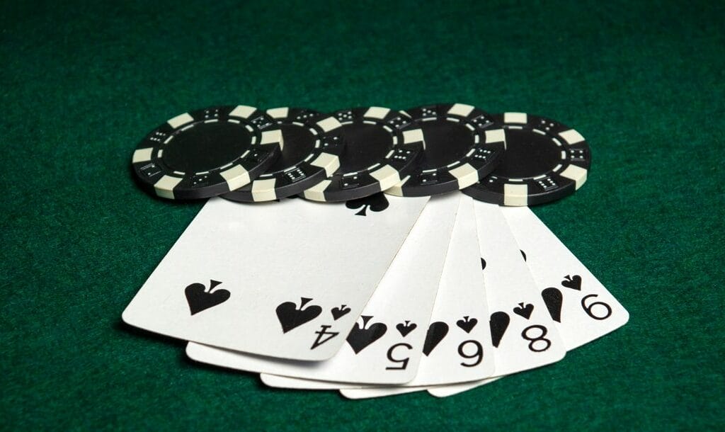 Cards and poker chips on poker table