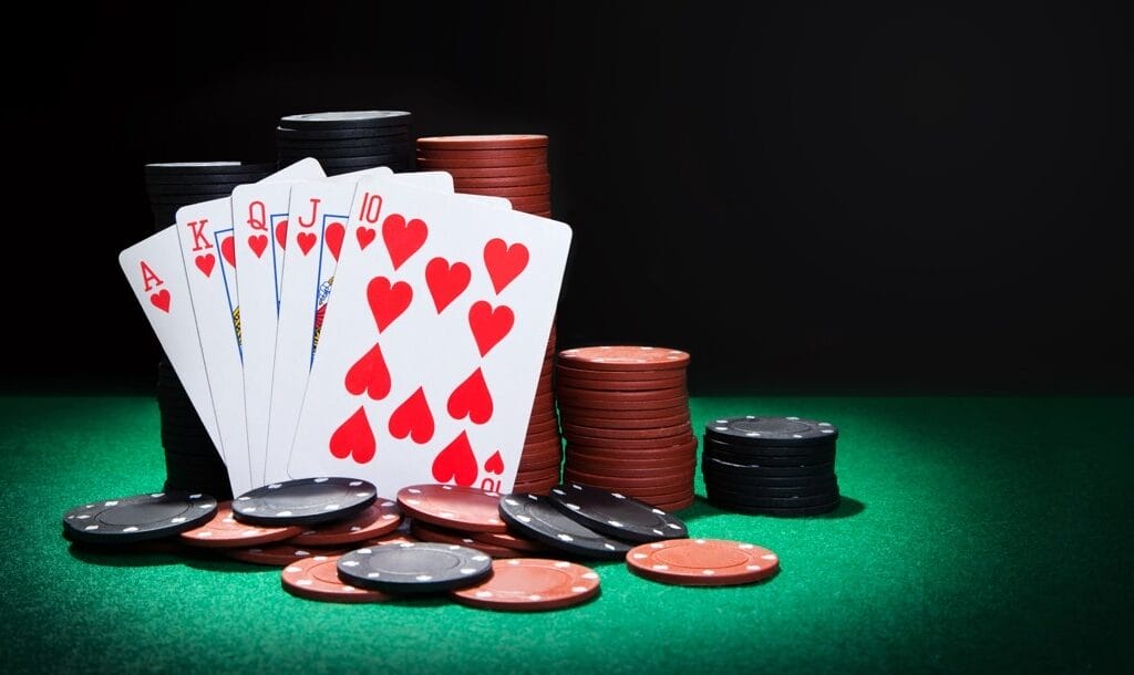 A-royal-flush-propped-up-against-stacks-of-poker-chips-Royal-flush