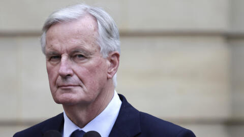 New French prime minister Michel Barnier looks on right during the handover ceremony, September 5, 2024 in Paris.