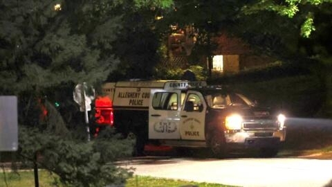 Allegheny County police department vehicles guard the perimeter of the home of Thomas Matthew Crooks in Bethel Park, Pennsylvania, on July 14, 2024.