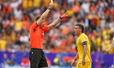 Munchen, Germany. 02nd July, 2024. MUNCHEN, GERMANY - JULY 2: Referee Felix Zwayer shows a yellow card to Nicolae Stanciu of Romania during the UEFA EURO 2024 Round of 16 match between Romania and Netherlands at Allianz Arena on July 2, 2024 in Munchen, G