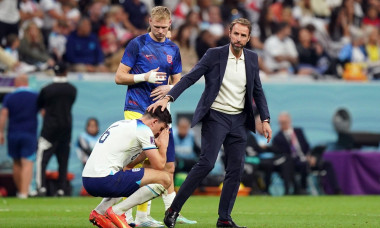 England&apos;s Harry Maguire is consoled by manager Gareth Southgate following defeat in the FIFA World Cup Quarter-Final match at the Al Bayt Stadium in Al Khor, Qatar. Picture date: Saturday December 10, 2022.