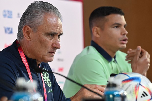 Brazil's coach Tite (L) and Brazil's defender #03 Thiago Silva (R) attend a press conference at the Qatar National Convention Center (QNCC) in Doha on December 4, 2022, on the eve of the Qatar 2022 World Cup football match between Brazil and South Korea. (Photo by NELSON ALMEIDA / AFP)