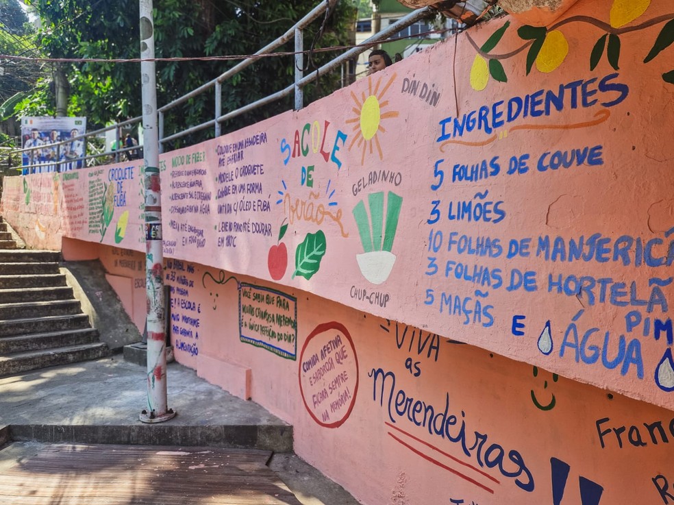 Terceira edição do trabalho pintado nos muros da Babilônia é voltada para a merenda das escolas do Rio — Foto: Divulgação/Regina Tchelly