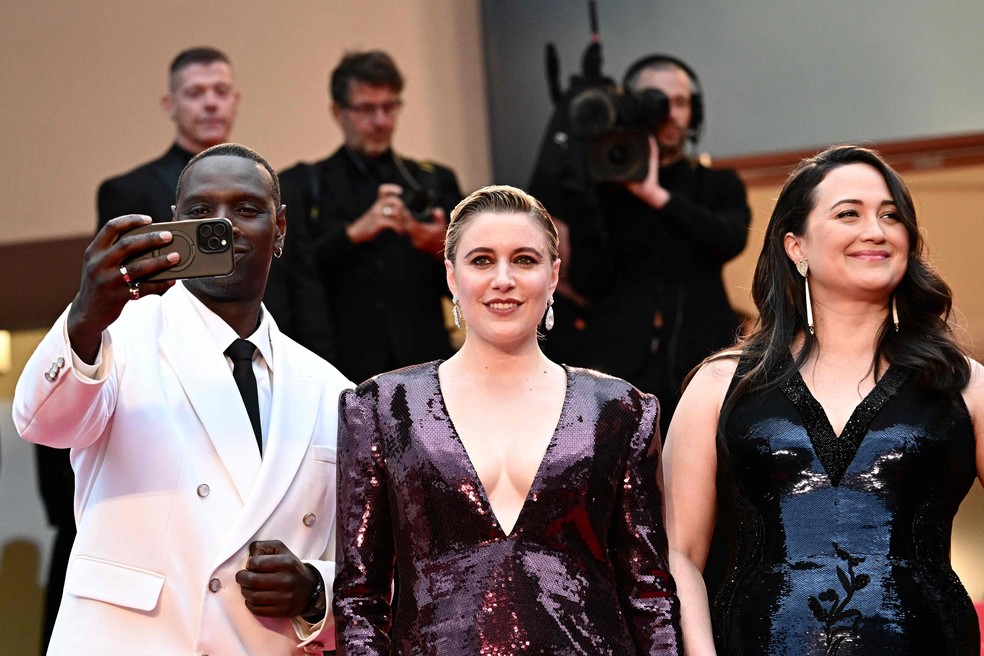 Omar Sy, Greta Gerwig e Lily Gladstone, jurados do Festival de Cannes 2024 — Foto: LOIC VENANCE / AFP