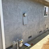 Existing panel in very textured stucco. Most agencies are requiring stucco repair to be inspected before they finalize a panel change.