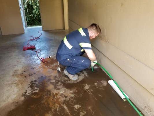 Photo of Bell Plumbing - San Carlos, CA, US. Hydrojetting sewer lateral from cleanout in carport