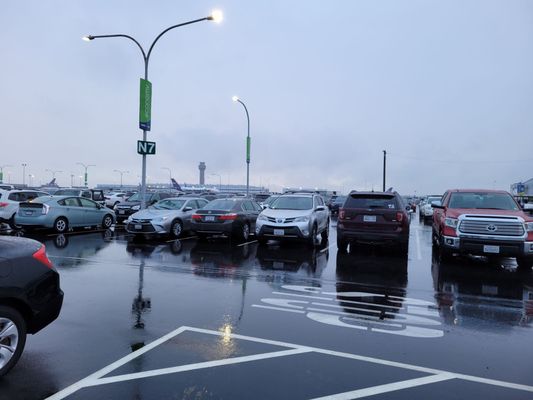 Photo of San Francisco Bay Oakland International Airport Parking Lot - Oakland, CA, US. The view from shuttle stop 3.