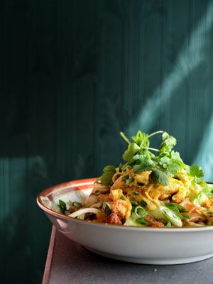 Photo of Maven - Calgary, AB, CA. Tembeling Road Noodles:
 chow fun, sprouts, fried garlic, chinese greens, crispy tofu, ginger, kecap manis, sesame oil, scallion omelettes