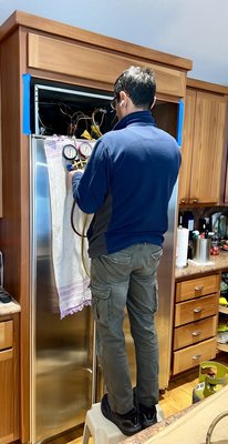 Photo of Azer Appliance & HVAC Repair - Union City, CA, US. Azer Appliance repair technician working his magic to repair the systemic refrigerator condenser coil issue with SubZero model 642 units.