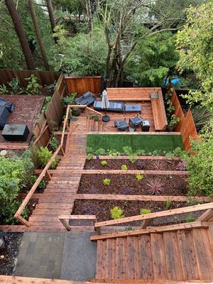 Photo of Tamate Landscaping - San Francisco, CA, US. Backyard make-over in Ashbury Hts, San Francisco with tiered retaining walls, deck, bench, & stairs.