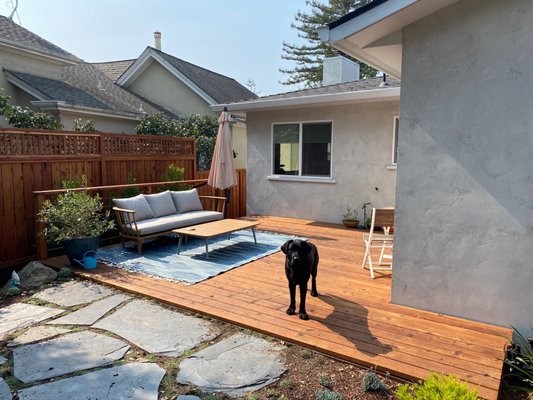 Photo of Terra Gardens - Berkeley, CA, US. The deck flows directly off the house onto the lawn. The grill will go to the right of the pup.
