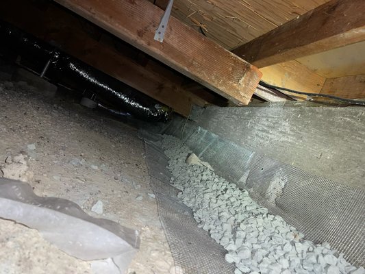 Photo of Crawlspace Clean - Danville, CA, US. "Rock bottom" foundation exclusion to stop rodents from digging under the foundation walls.