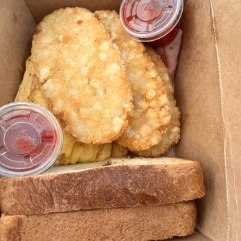 Regular breakfast combo with egg, hash brown, ham and toast