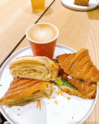 Photo of Maison Nico - San Francisco, CA, US. Oat milk cappuccino, croissant, salmon croissant sandwich