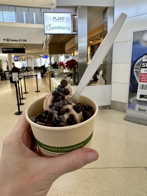 Photo of Pinkberry - San Francisco, CA, US. a hand holding a cup of ice cream