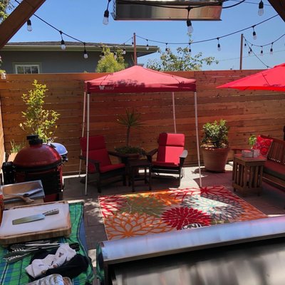 Photo of JML Landscapes - San Francisco, CA, US. a patio with red umbrellas