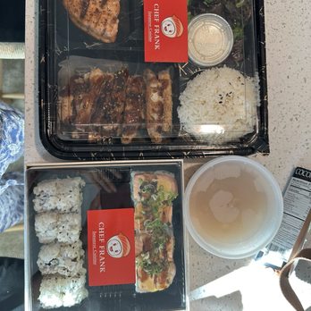 Two item bento box with salmon teriyaki and tonkatsu, California roll, Lion King roll.