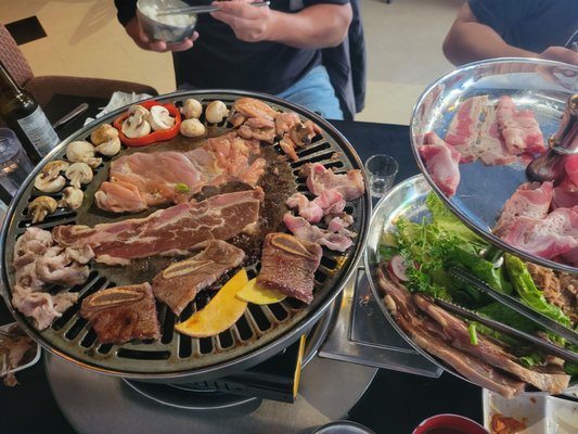 Photo of Sura Korean Cuisine - Victoria, BC, CA. Pork, beef and chicken for 4 combo set.