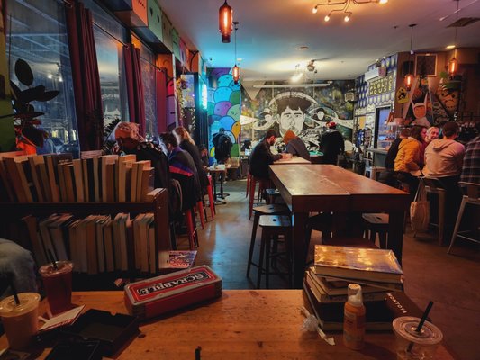 Photo of Bushwick Public House - Brooklyn, NY, US. people sitting at tables in a bookstore