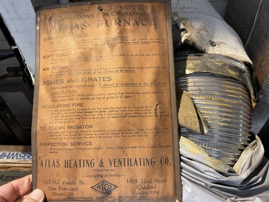 Photo of Atlas Heating - Oakland, CA, US. Original ATLAS sign & a sample of their lovely flexible aluminum ducting that is not up to code!