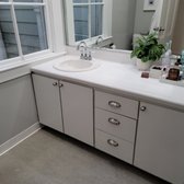 Custom designed bathroom remodeling. Sink fixtures, cabinetry, painting, light fixtures, finish work. Home improvement project.