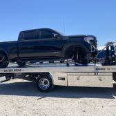 This is a lifted GMC missing a wheel and tire were able to put a jack under it and safely bring it up without any further damage