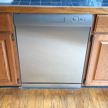 cabinets and raised floor built in around the dishwasher