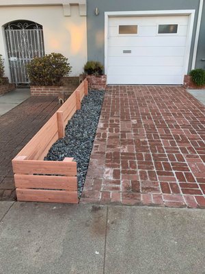 Photo of Logiculture - San Francisco, CA, US. a brick walkway with a raised planter bed